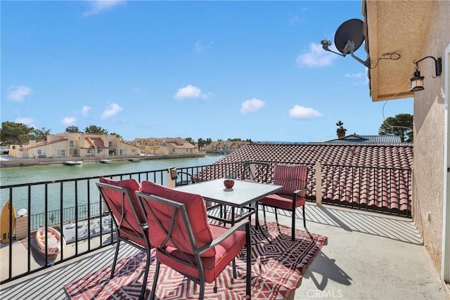 balcony featuring a water view