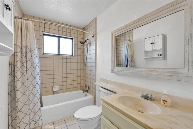 full bathroom featuring shower / tub combo with curtain, vanity, a textured ceiling, tile patterned floors, and toilet