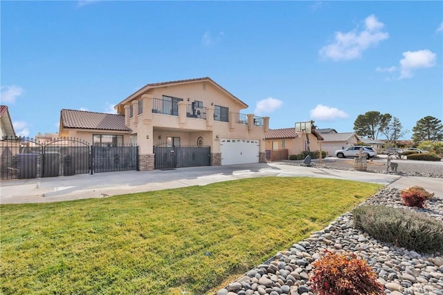 view of front of property featuring a garage and a front lawn