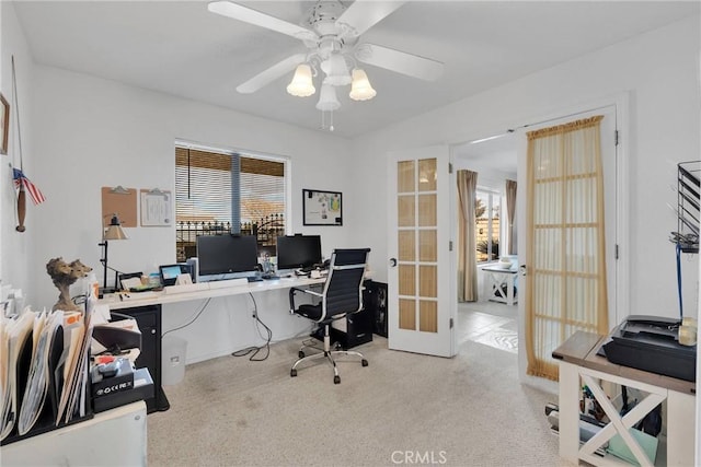 carpeted office featuring french doors and ceiling fan