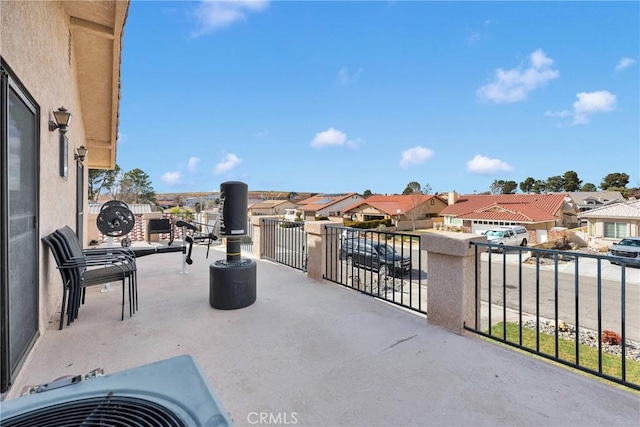 view of patio featuring a balcony