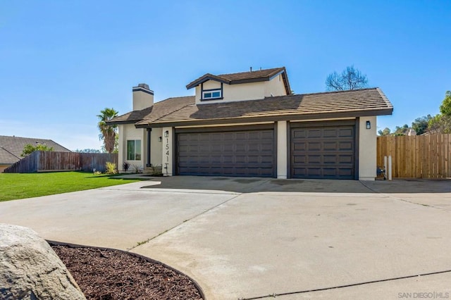 front facade with a garage and a front yard