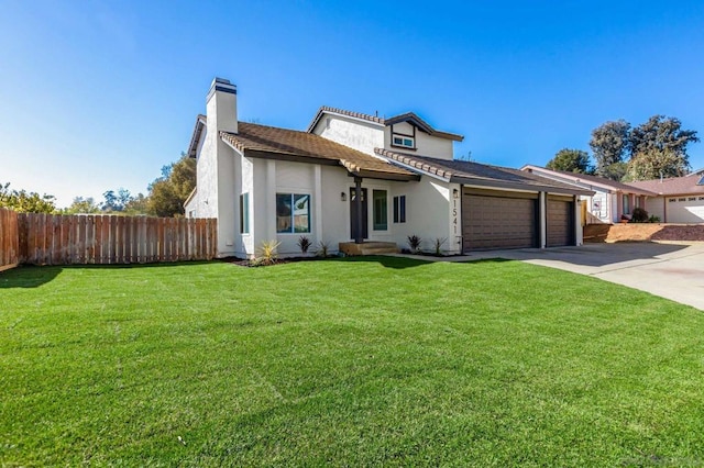 view of front facade featuring a garage and a front lawn