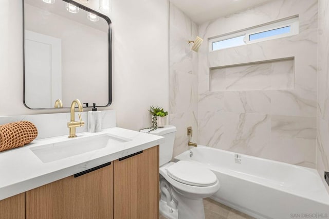 full bathroom featuring vanity, toilet, and tiled shower / bath combo