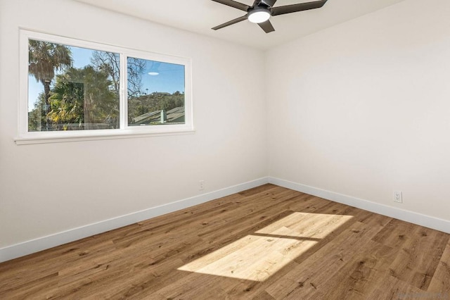 empty room featuring hardwood / wood-style floors and ceiling fan