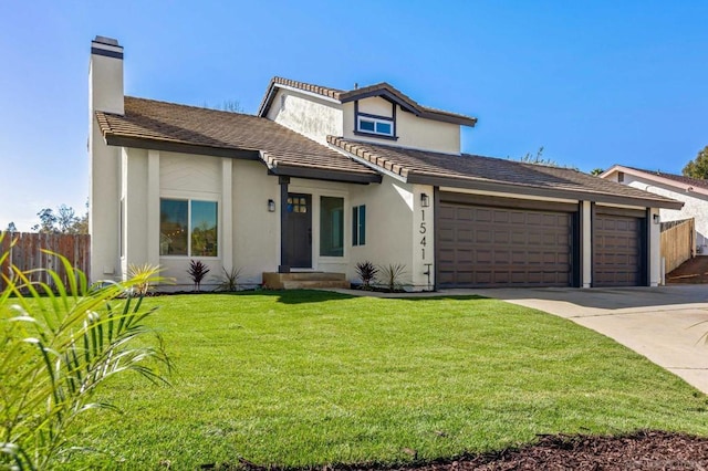 view of front facade featuring a garage and a front lawn