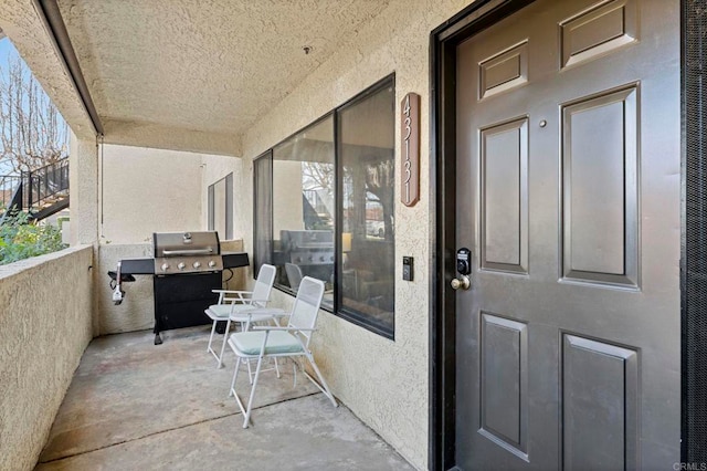 entrance to property with a balcony