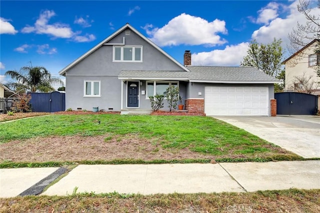 view of front of home with a garage and a front lawn