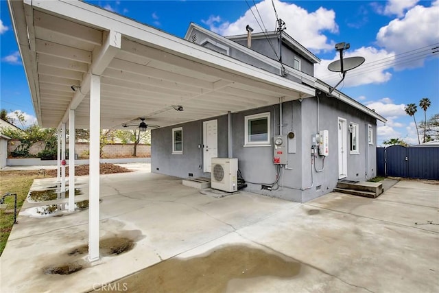 view of front of home featuring ac unit, a patio area, and ceiling fan