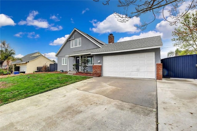 view of front property featuring a garage and a front yard