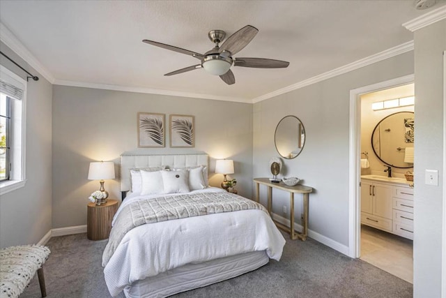 carpeted bedroom featuring sink, crown molding, ensuite bath, and ceiling fan