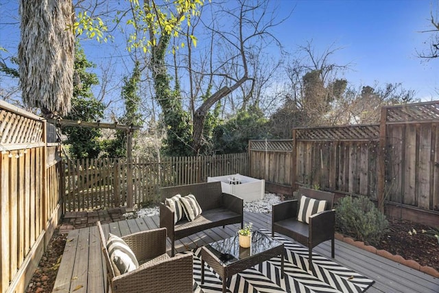 wooden terrace featuring an outdoor hangout area