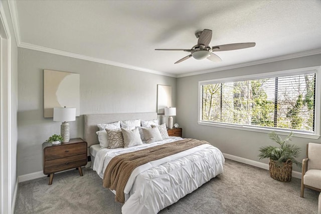 carpeted bedroom featuring crown molding and ceiling fan