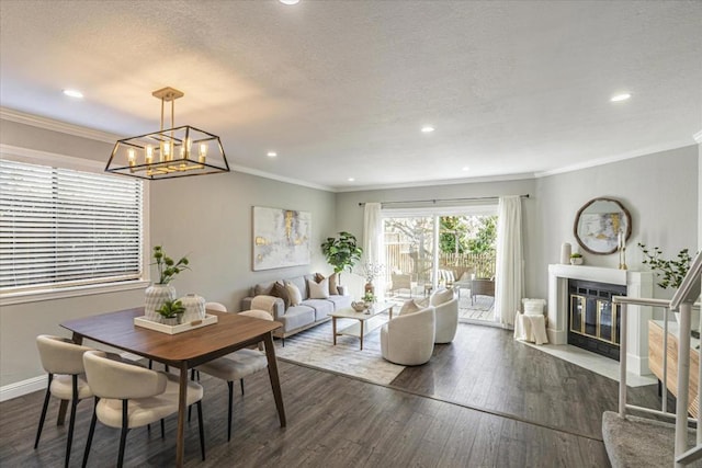 dining room with crown molding, an inviting chandelier, a textured ceiling, and dark hardwood / wood-style flooring