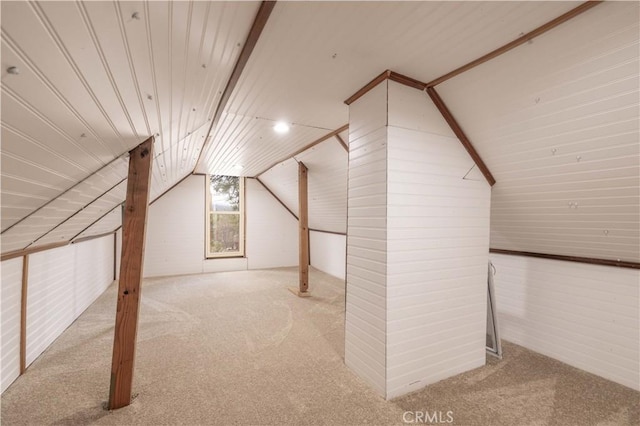 additional living space with lofted ceiling, carpet floors, and wooden ceiling