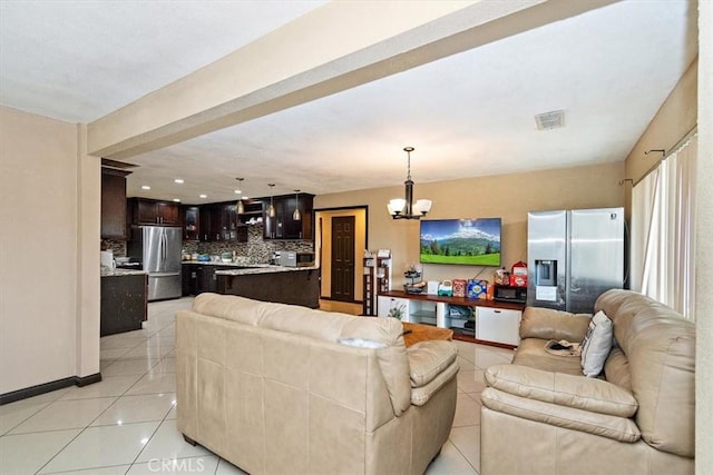 1230 Sunshine Dr, Barstow, CA 92311 - living room with an inviting chandelier and light tile patterned flooring