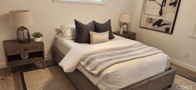 bedroom featuring hardwood / wood-style floors