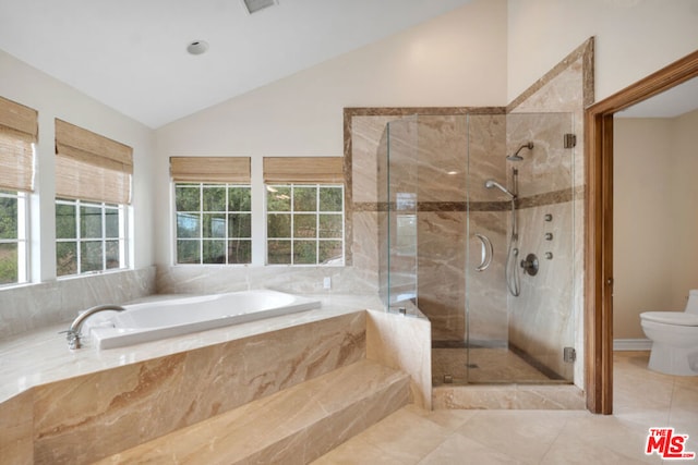 bathroom featuring toilet, plus walk in shower, and vaulted ceiling