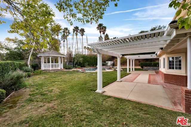 view of yard with a gazebo, a patio, and a pergola