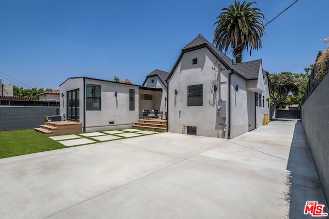 rear view of house featuring a patio area