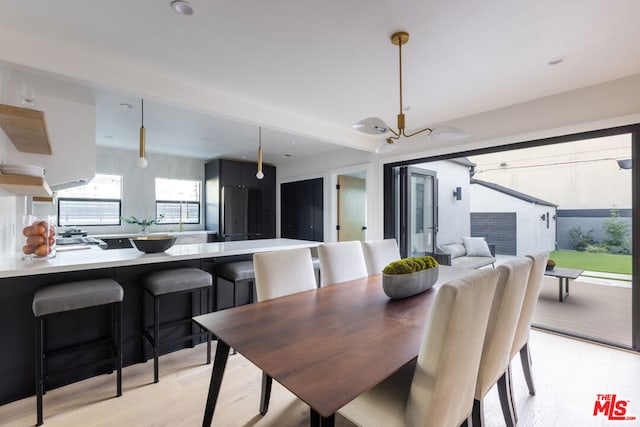 dining area with light hardwood / wood-style floors