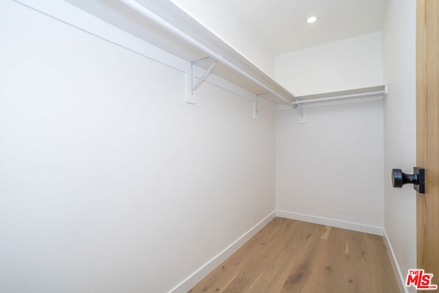 walk in closet featuring light hardwood / wood-style floors