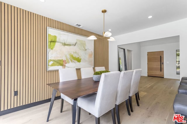 dining space with light wood-type flooring