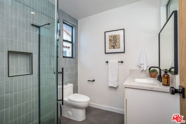 bathroom featuring vanity, toilet, and walk in shower