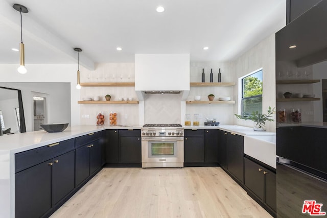 kitchen featuring high end range, hanging light fixtures, light hardwood / wood-style floors, kitchen peninsula, and beam ceiling