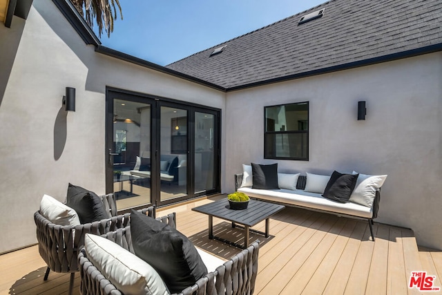 wooden terrace featuring outdoor lounge area