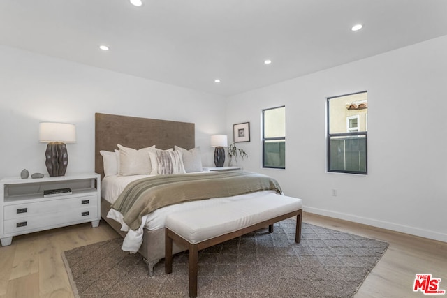 bedroom with light hardwood / wood-style flooring