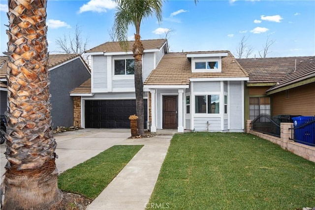 view of front of property with a garage and a front lawn