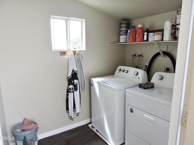 laundry room featuring washing machine and dryer and dark hardwood / wood-style flooring