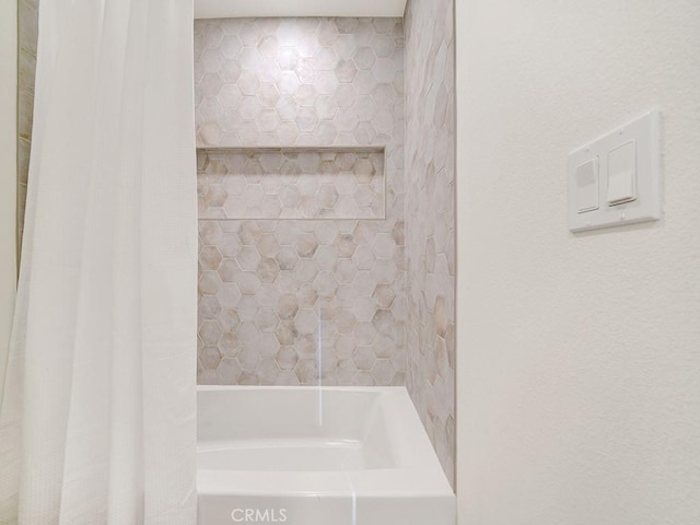 bathroom featuring shower / bath combo with shower curtain