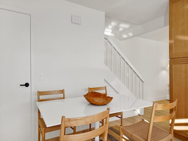 dining room with hardwood / wood-style flooring