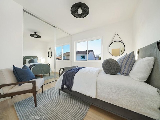 bedroom with light hardwood / wood-style flooring