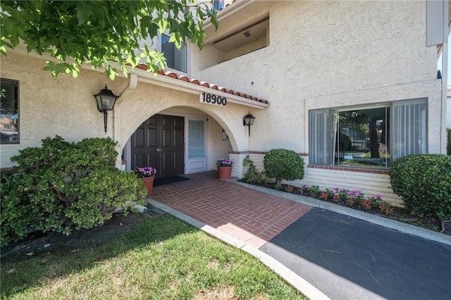 doorway to property with a patio