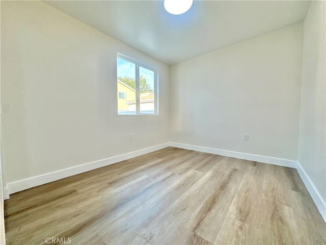 spare room featuring light wood-type flooring