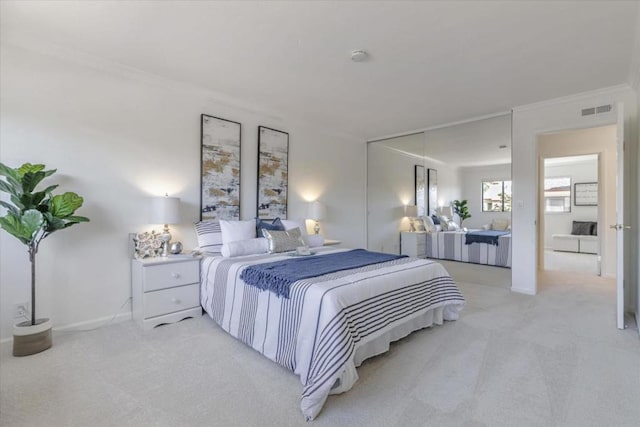 carpeted bedroom featuring ornamental molding