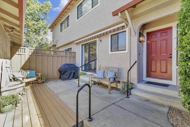 entrance to property with a patio