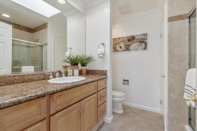 bathroom featuring crown molding, tile patterned flooring, a skylight, vanity, and a shower with shower door