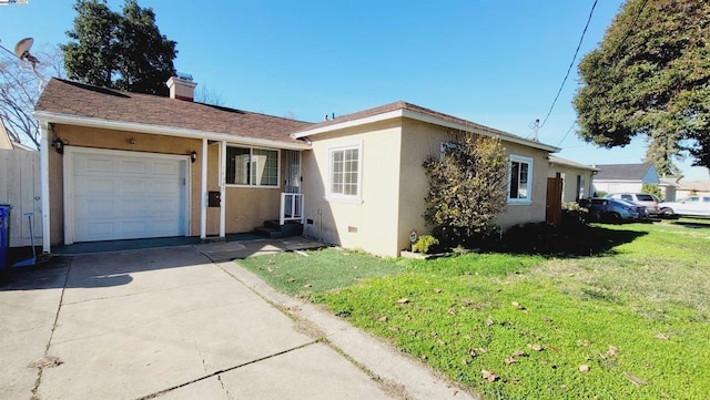 single story home with a garage and a front lawn