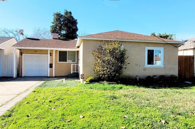 view of front facade featuring a garage and a front lawn