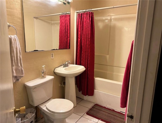 full bathroom with shower / tub combo, sink, tile patterned floors, and toilet