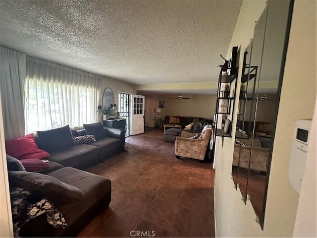 tiled living room with a textured ceiling