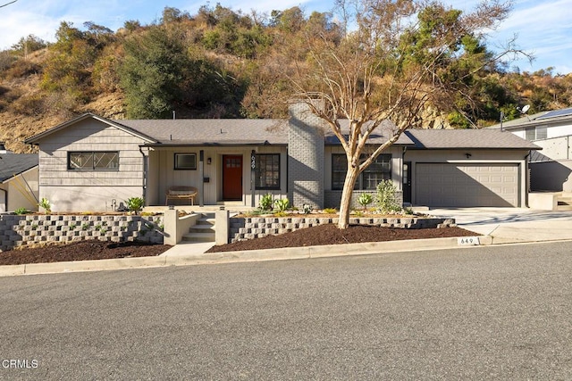 ranch-style home featuring a garage