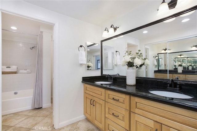 bathroom with tile patterned flooring, vanity, and shower / bath combination with curtain