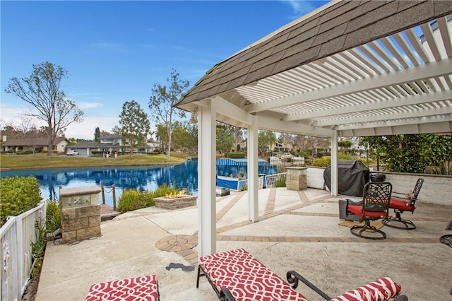 view of patio / terrace with a water view, a grill, and a pergola