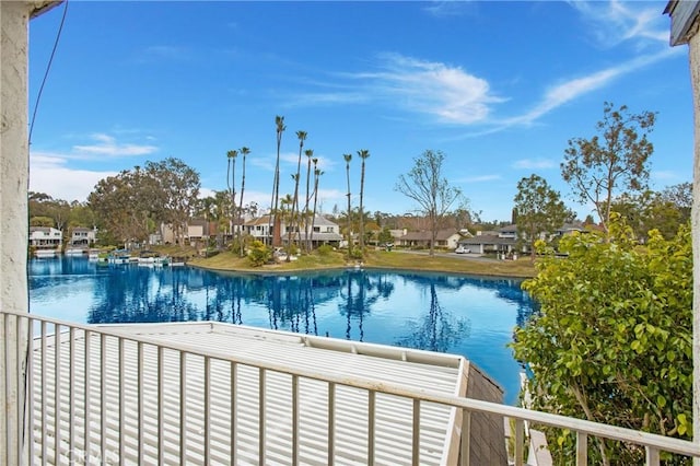 view of swimming pool with a water view