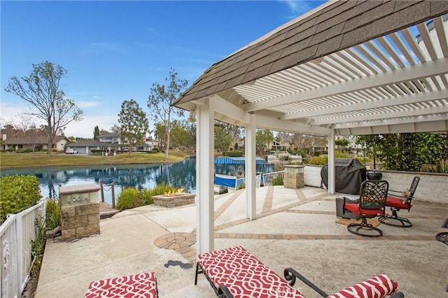 view of patio / terrace featuring a water view, a grill, and a pergola